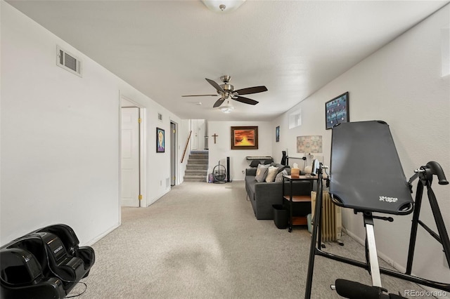 exercise area with ceiling fan, baseboards, visible vents, and carpet