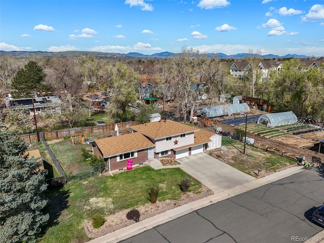 birds eye view of property featuring a residential view and a mountain view