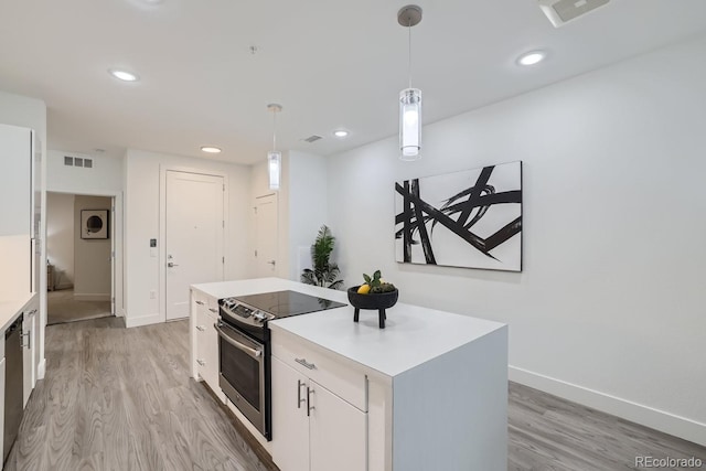 3500 S Corona St Unit 407, Englewood, CO 80113 - kitchen featuring appliances with stainless steel finishes, light wood-style floors, white cabinets, baseboards, and recessed lighting