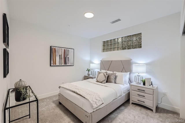 3500 S Corona St Unit 407, Englewood, CO 80113 - bedroom with light colored carpet and baseboards