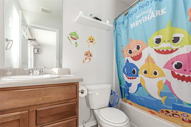 bathroom featuring vanity, shower / bath combination with curtain, toilet, and visible vents