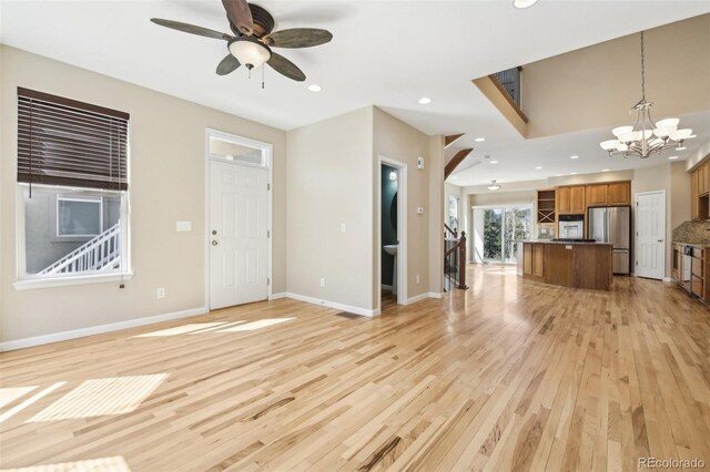 836 Vernon Dr, Central City, CO 80427 - unfurnished living room with recessed lighting, baseboards, ceiling fan with notable chandelier, and light wood finished floors