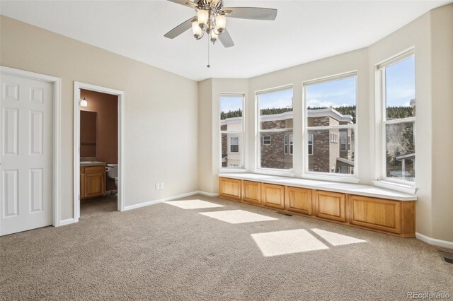 836 Vernon Dr, Central City, CO 80427 - empty room featuring a ceiling fan, baseboards, light colored carpet, and visible vents