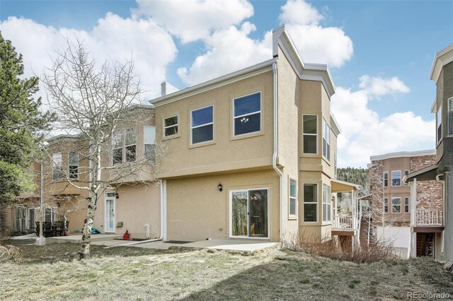 836 Vernon Dr, Central City, CO 80427 - back of property featuring a patio and stucco siding