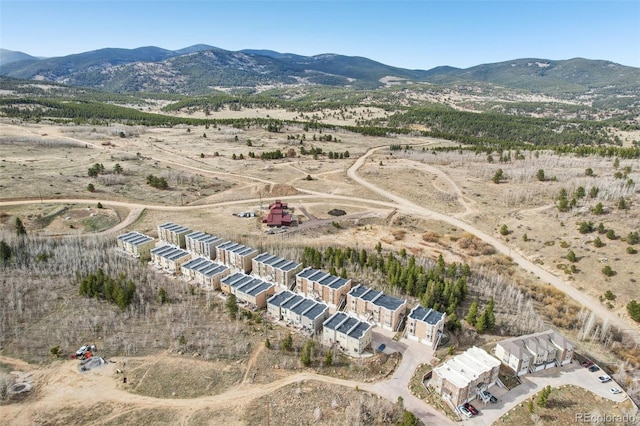 birds eye view of property with a rural view and a mountain view