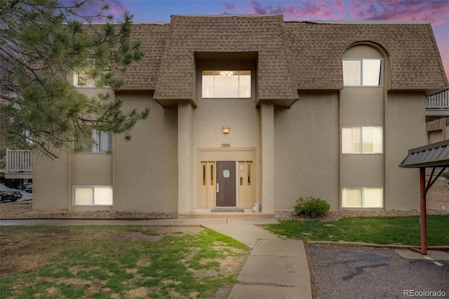 view of property at dusk
