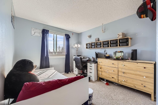 carpeted bedroom featuring a textured ceiling