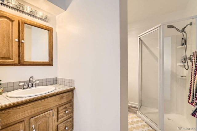 bathroom featuring vanity and walk in shower