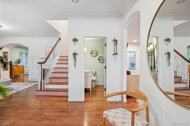 600 Vine St, Denver, CO 80206 - stairs featuring wood finished floors, ornamental molding, recessed lighting, and baseboards