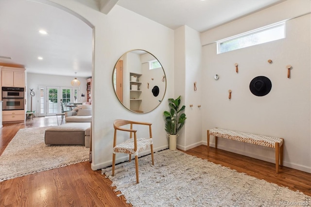 600 Vine St, Denver, CO 80206 - hall with wood finished floors, baseboards, arched walkways, and recessed lighting