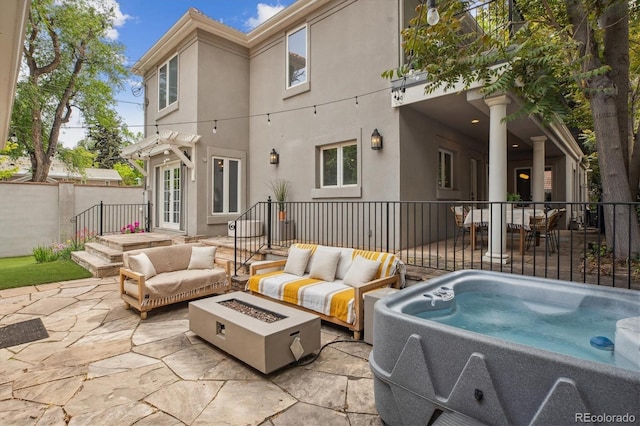 600 Vine St, Denver, CO 80206 - view of patio featuring an outdoor living space with a fire pit and a hot tub