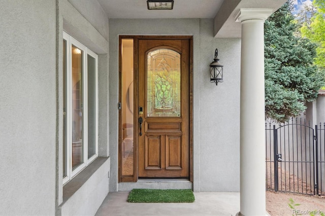 600 Vine St, Denver, CO 80206 - property entrance featuring stucco siding and a gate
