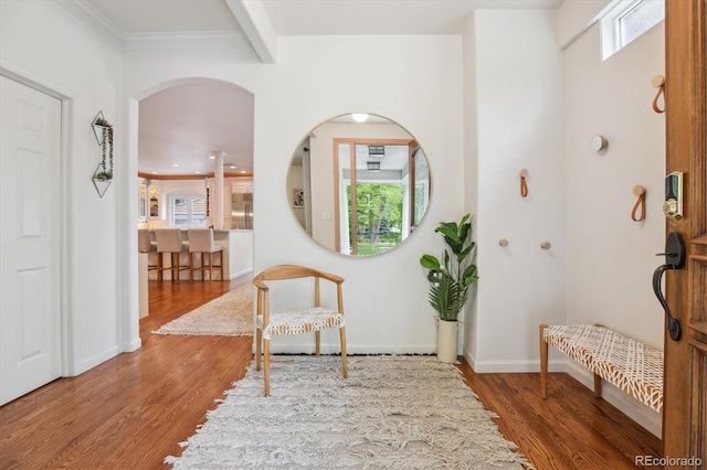 600 Vine St, Denver, CO 80206 - foyer entrance with wood finished floors, arched walkways, baseboards, beamed ceiling, and ornamental molding