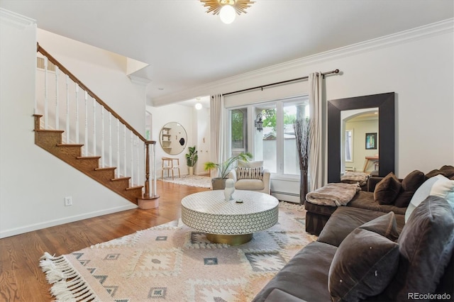 600 Vine St, Denver, CO 80206 - living room with ornamental molding, a baseboard heating unit, wood finished floors, stairs, and arched walkways