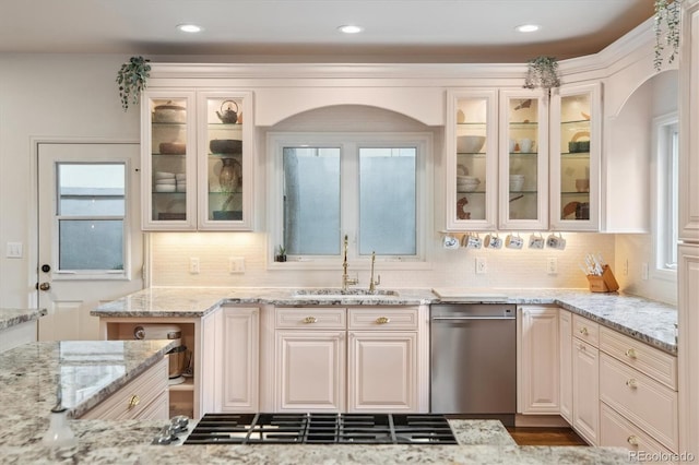 600 Vine St, Denver, CO 80206 - kitchen featuring a sink, stainless steel dishwasher, backsplash, light stone counters, and recessed lighting
