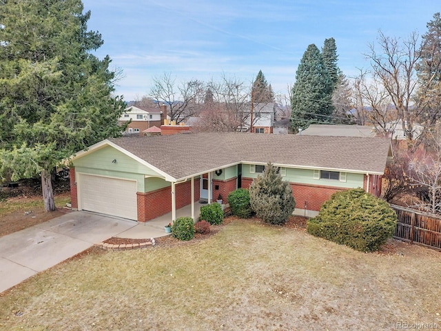 single story home featuring a garage and a front lawn