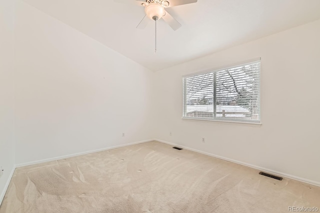 carpeted empty room featuring ceiling fan