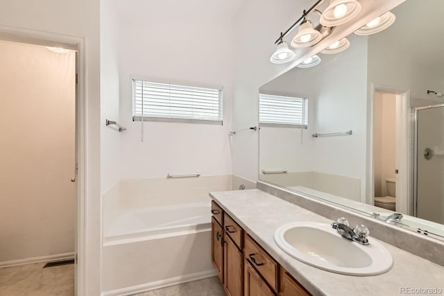 full bathroom with independent shower and bath, vanity, and toilet