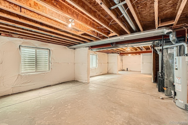 basement with heating unit and gas water heater