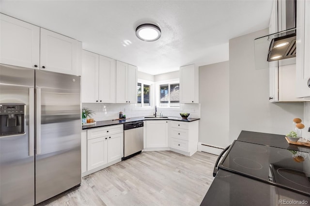 kitchen with white cabinetry, sink, stainless steel appliances, and light wood-type flooring