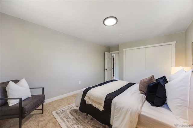 carpeted bedroom with a closet