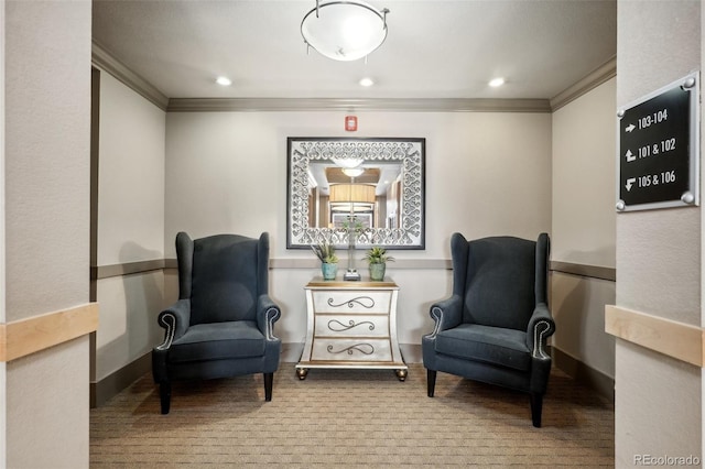 living area featuring crown molding and light colored carpet