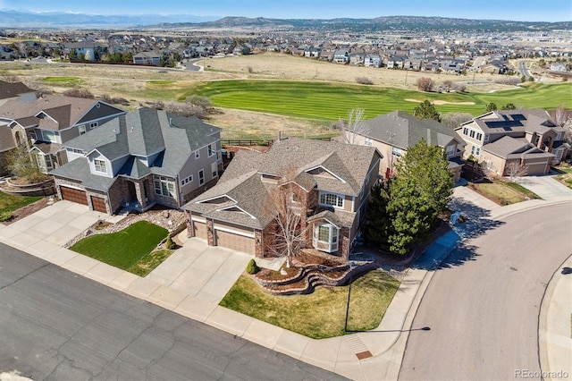 bird's eye view with a mountain view, golf course view, and a residential view