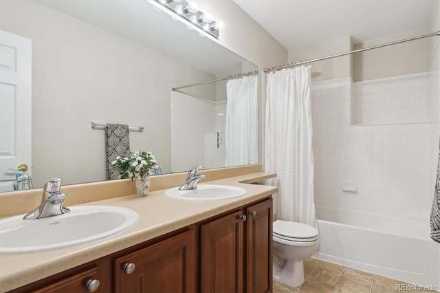 full bath with toilet, double vanity, shower / bath combo with shower curtain, and a sink