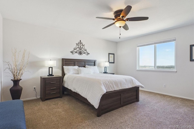 bedroom with carpet flooring, baseboards, and ceiling fan
