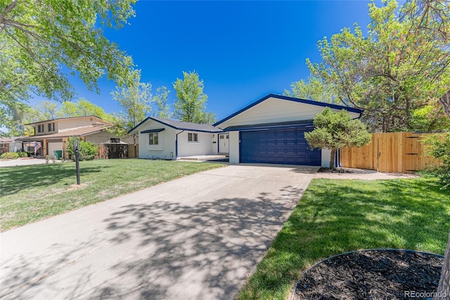1486 S Kingston St, Aurora, CO 80012 - ranch-style house featuring concrete driveway and an attached garage