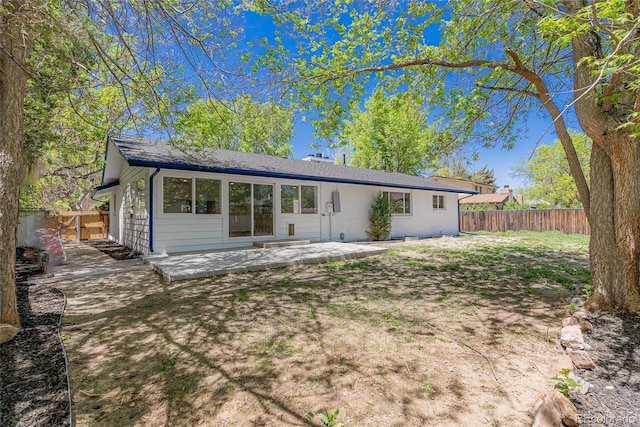 1486 S Kingston St, Aurora, CO 80012 - back of property featuring a fenced backyard and a patio