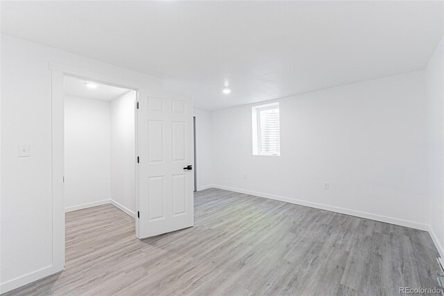1486 S Kingston St, Aurora, CO 80012 - basement with light wood-type flooring, baseboards, and recessed lighting