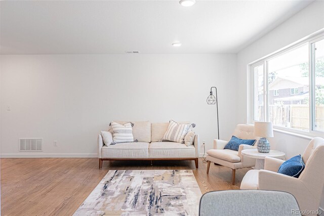 1486 S Kingston St, Aurora, CO 80012 - living area featuring wood finished floors, baseboards, and recessed lighting