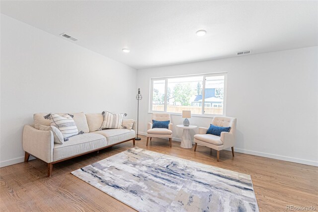 1486 S Kingston St, Aurora, CO 80012 - living area featuring wood finished floors and baseboards