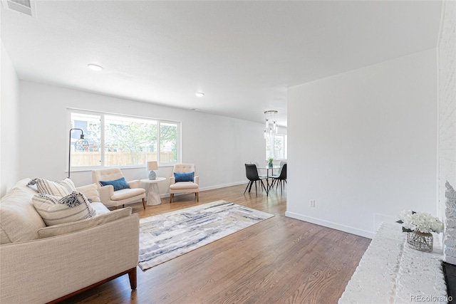 1486 S Kingston St, Aurora, CO 80012 - living room featuring wood finished floors, baseboards, and recessed lighting