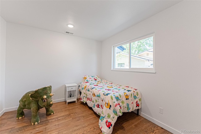 1486 S Kingston St, Aurora, CO 80012 - bedroom featuring light wood-style flooring and baseboards