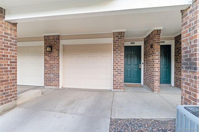2154 Concord Ln, Superior, CO 80027 - property entrance with brick siding and concrete driveway