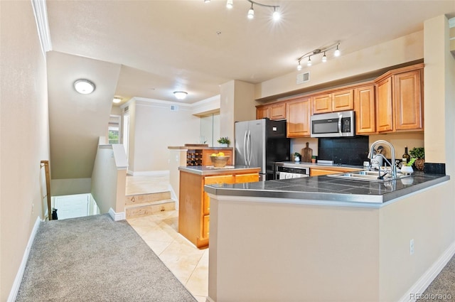 2154 Concord Ln, Superior, CO 80027 - kitchen featuring appliances with stainless steel finishes, a sink, a center island, a peninsula, and light tile patterned floors