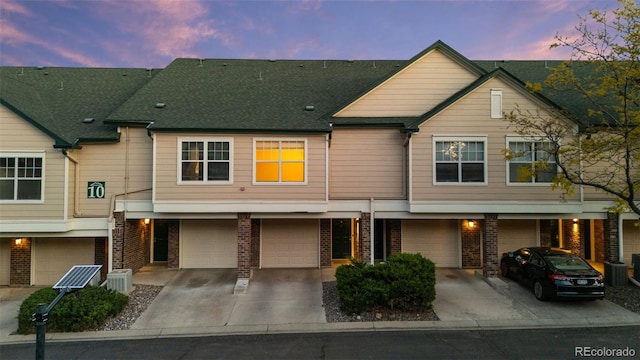 2154 Concord Ln, Superior, CO 80027 - townhome / multi-family property featuring driveway, a garage, and brick siding