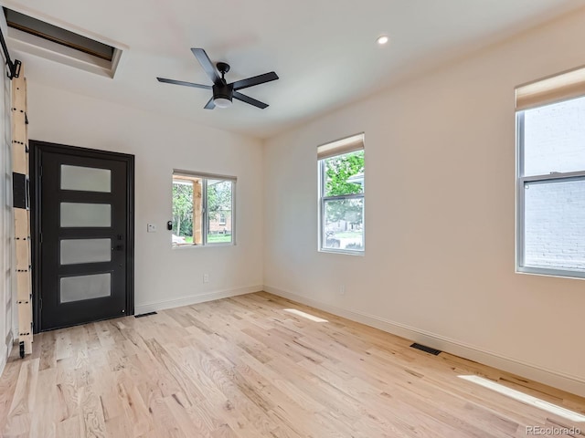 foyer entrance with light wood-style flooring, ceiling fan, baseboards, and recessed lighting