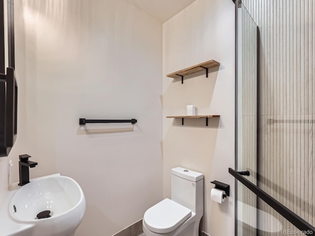 half bathroom with a sink and toilet