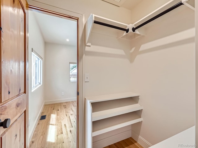 spacious closet with light wood-style flooring