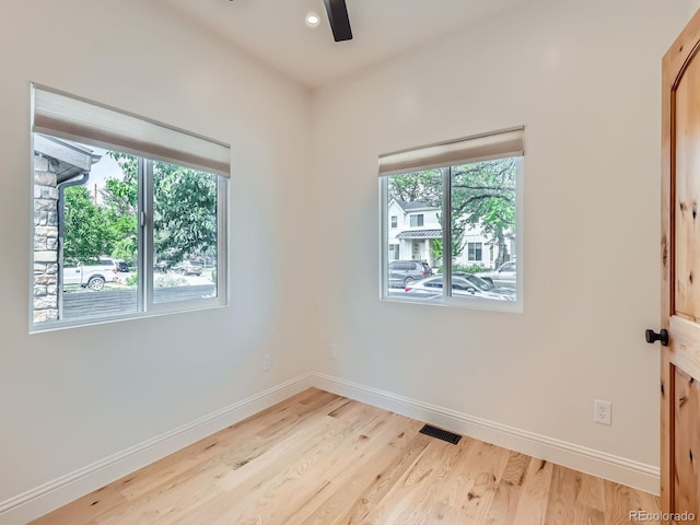 unfurnished room with plenty of natural light, baseboards, a ceiling fan, light wood-style flooring, and recessed lighting