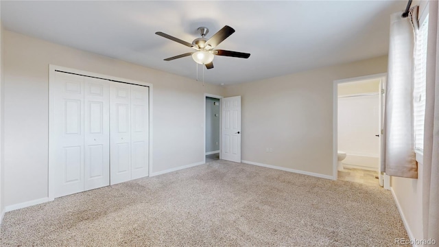 unfurnished bedroom featuring a closet, carpet flooring, and baseboards