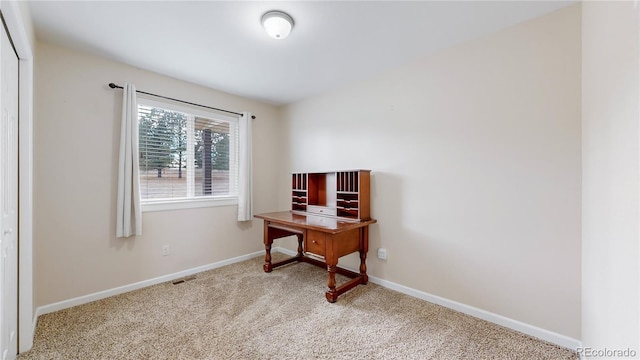 office space with carpet, visible vents, and baseboards