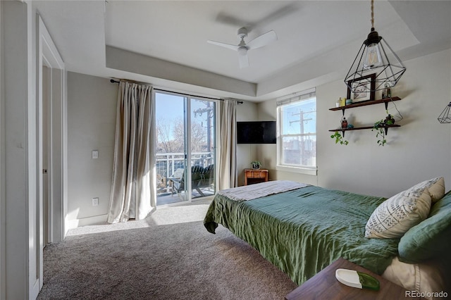 bedroom with access to exterior, ceiling fan, and carpet flooring