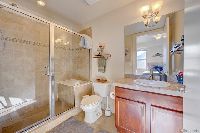 bathroom with vanity, toilet, an enclosed shower, and tile patterned flooring