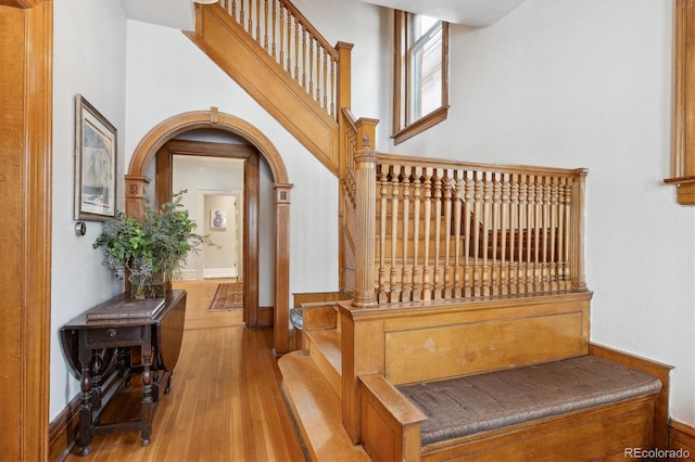 stairs with hardwood / wood-style flooring