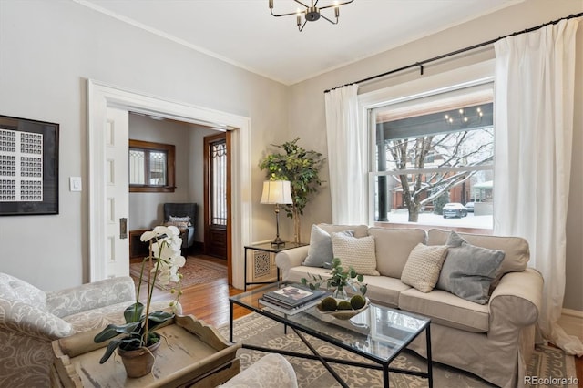 living room featuring hardwood / wood-style floors and a notable chandelier