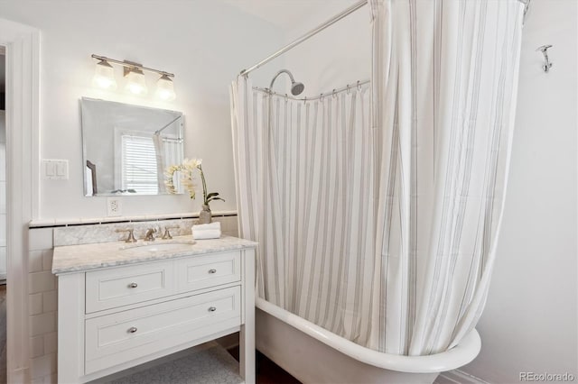 bathroom featuring vanity and shower / tub combo with curtain